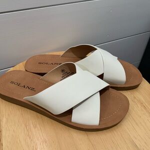 New never worn. Solanz, White slide on sandals.